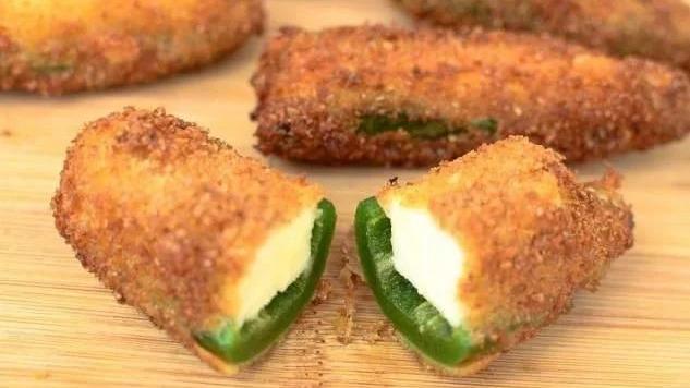 Jalapeño Poppers · Mild jalapenos stuffed with fresh cream cheese and coated with a crunchy potato breading.