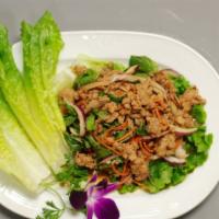 Larb (Chicken Or Beef) · Chicken or beef. Finely sliced meat of your choice with ground roasted rice.