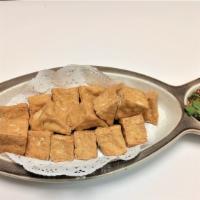Fried Tofu · Deep fried tofu served with sweet and sour sauce and ground peanut.