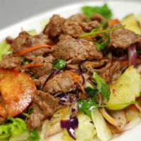 Beef Salad · Sliced beef with  lettuce,cucumber, tomato, red onion, mint leaves , cilantro, and spicy lim...