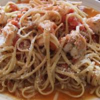 Shrimp Scampi · Sautéed in garlic, león, butter, and tomatoes.