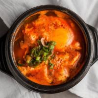 Spicy Tofu Stew · Spicy tofu soup with seafood.