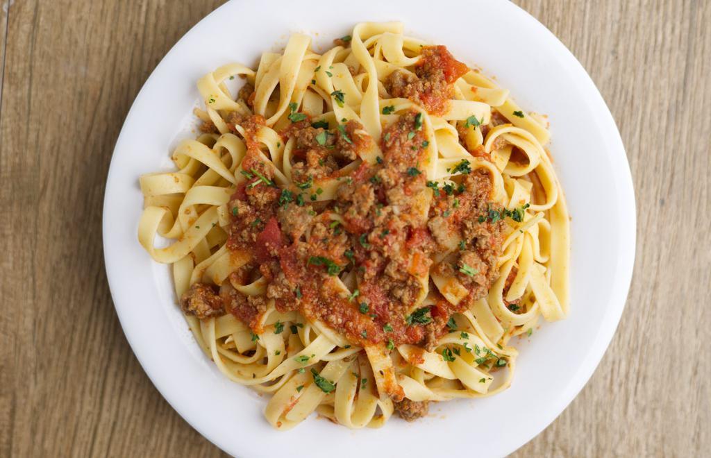 Pasta Bolognese · Traditional Italian slow-cooked meat sauce with fettucini.