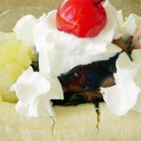 Banana Split · Chocolate, Strawberry, and vanilla ice cream, topped with fresh banana, whipped cream, nuts,...