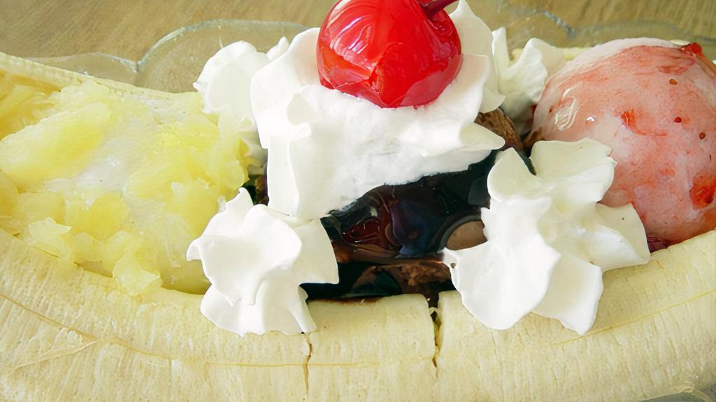 Banana Split · Chocolate, Strawberry, and vanilla ice cream, topped with fresh banana, whipped cream, nuts, and a cherry.