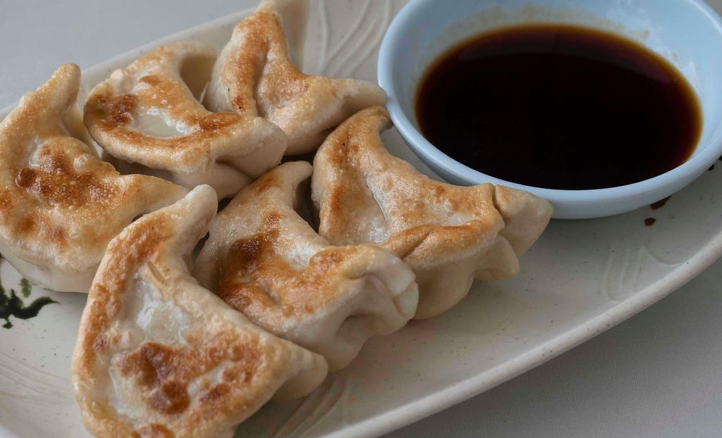 Pot Stickers · Served with delicious ginger sauce.