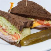 3 Cheese And Ham Sandwich · Sliced country ham, American, Swiss and pepperjack cheeses, cold shredded lettuce, crisp tom...