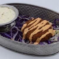 Spicy Crab Cakes · Crab Cakes fried to a golden brown, drizzled with Spicy House Chipotle Sauce. 4.95 each
