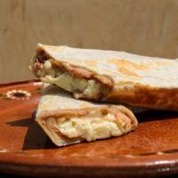 Relaxing Chorizo Breakfast Burrito · Two scrambled eggs with delicious chorizo, tater tots, and melted cheese wrapped up in a flo...