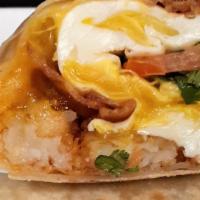 Hipster Avocado Breakfast Burrito · Two scrambled eggs with delicious carne asada, tater tots, melted cheese, guacamole, wrapped...