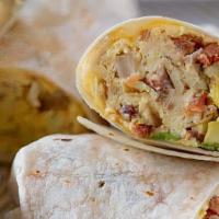 Fajita Veggie Breakfast Burrito · Two scrambled eggs, sauteed peppers and onions, tater tots, and melted cheese on a fresh flo...