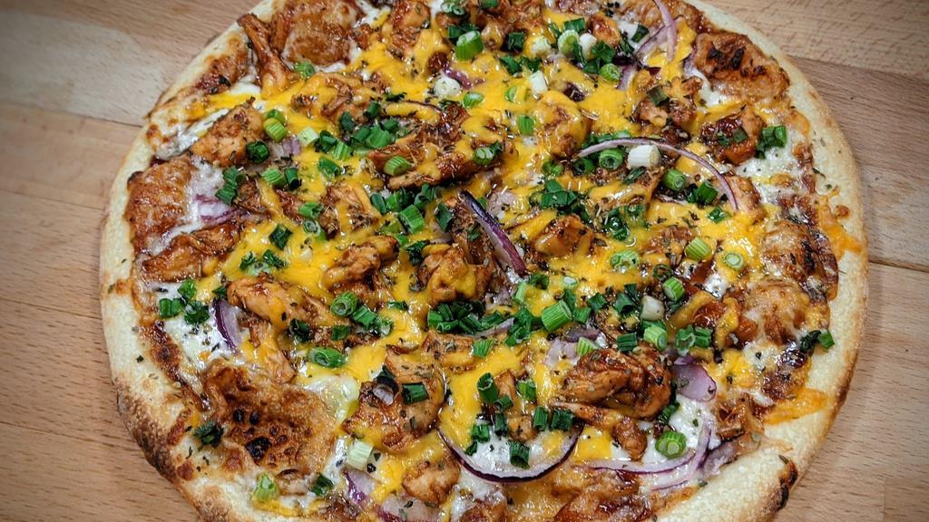 The B~Que - Bbq Chicken · Sweet Baby Ray's BBQ sauce, Mozzarella, roasted chicken smothered in BBQ sauce, red and green onions, topped with cheddar cheese.