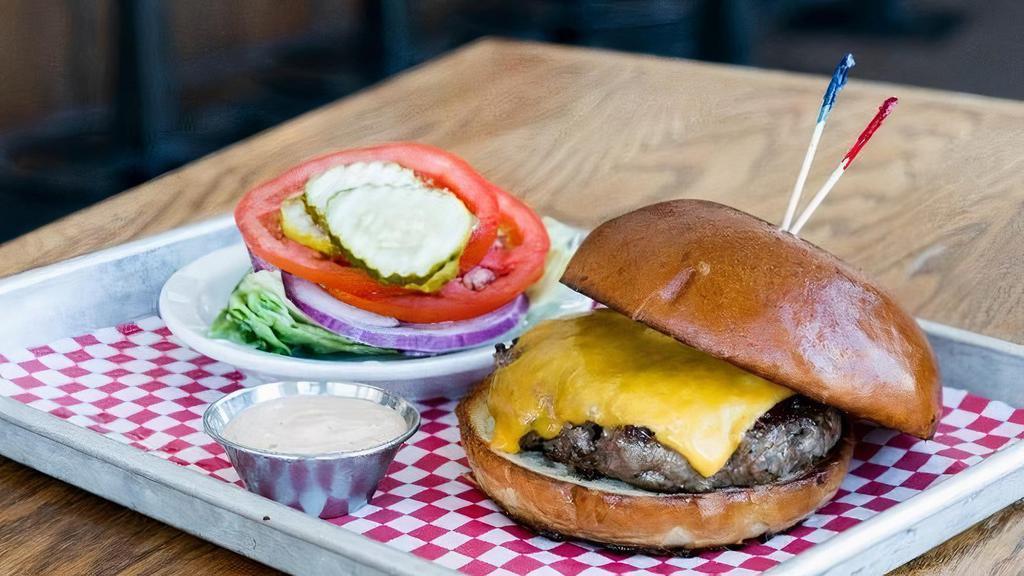 1/4 Lb Cheeseburger · 4 oz. house ground beef patty. Served on a classic bun. *lettuce, tomato, onion & pickles served on the side*