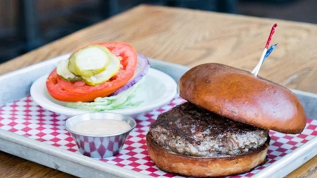 1/4 Lb Burger · 4oz house ground beef patty. Served on a classic bun. *lettuce, tomato, onion & pickles served on the side*