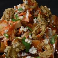 Holy Cluckin Tots · bacon, chicken, spicy slaw, fried jalapenos, blue cheese crumbles, ranch, buffalo sauce, tha...