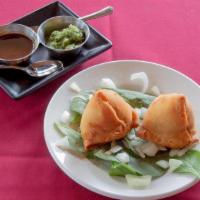 Vegetable Samosa (Regular) · Crisp patties filled with mildly spiced potatoes and peas