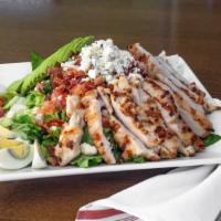 The Montana Cobb Salad · Chicken, romaine lettuce, avocado, bacon, hard-boiled eggs, tomatoes, and blue cheese.