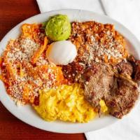 B&C Chilaquiles · Served with Beans, Sour Cream, Guacamole, Eggs, Chilaquiles, and a piece of Carne Asada.