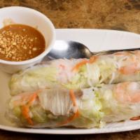 Spring Rolls (2 Pcs)  · Delicate rice paper rolled with carrots, lettuce, pork, and shrimp served with Phodera's pea...