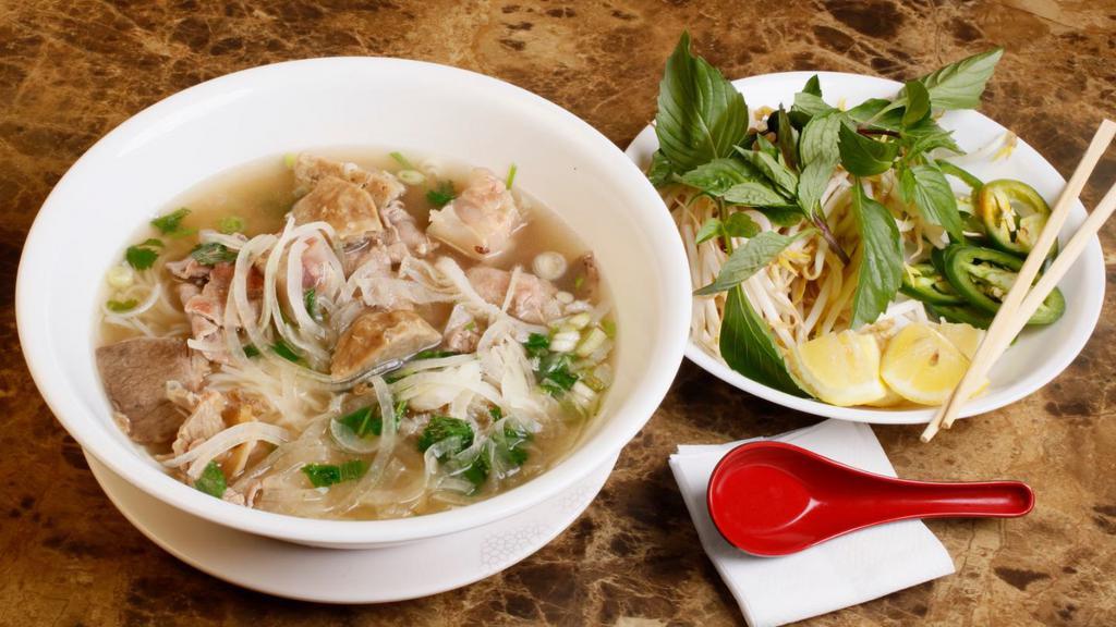 House Special Pho · Rare steak slices, well-done brisket, flank, tendon, tripe and meet all in a large bowl