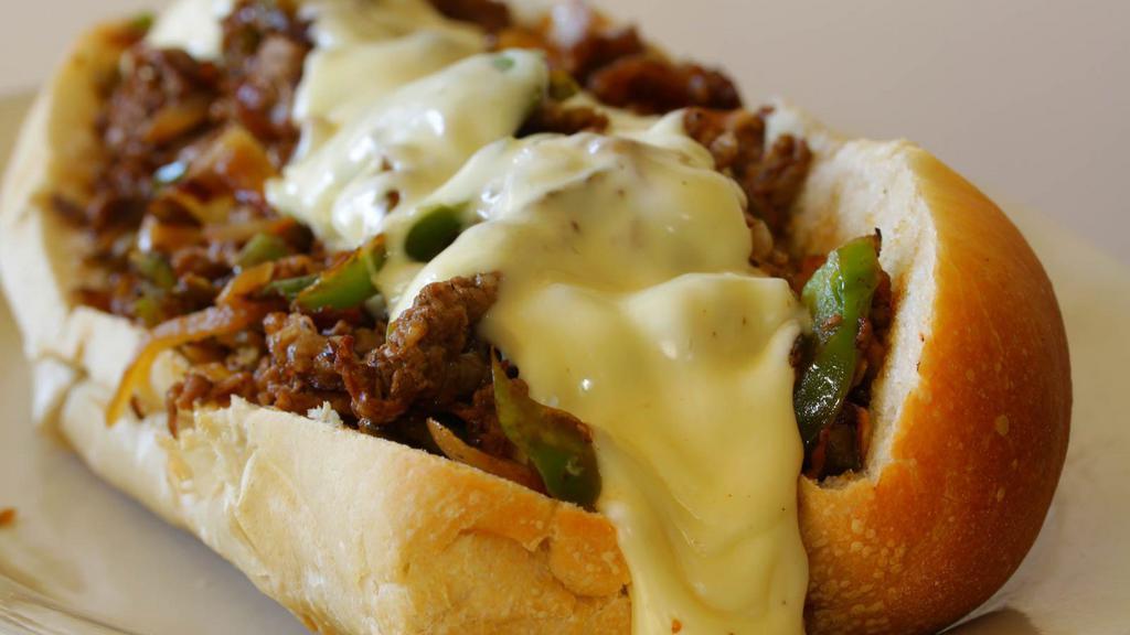 Philly Cheese Steak Sandwich · Juicy roast beef, onions, peppers, and American cheese.