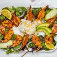 Camaron Zarandeado · Butterflied shell shrimp cooked on our special nayarit style sauce, served with rice and sal...