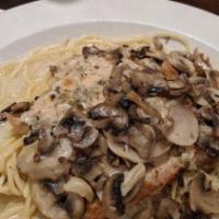 Chicken Marsala · Herbed chicken breast lightly floured. Sautéed in a marsala wine sauce with mushrooms and a ...