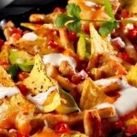 Nachos · Super nachos with crispy tortilla chips loaded with fresh avocado, pico de gallo, choice of ...