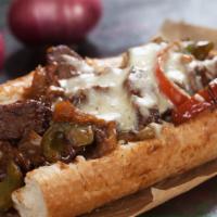 Philly Cheesesteak · Served on an authentic roll. Your choice of a half pound of steak or chicken cheesesteak wit...