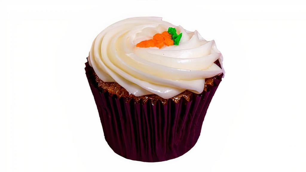 Carrot Cream Cheese · Fresh carrot, raisin, pineapple, & walnut cupcake topped with cream cheese frosting.