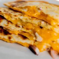Kids Quesadilla. · Cheesy Deliciousness 🧀, but kid's size! Served with Avocado, Flavor Choice & a small Agua F...