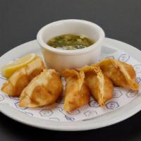 Pork Gyoza · Deep-fried pork dumpling, lemon with vinegar sauce with green onion