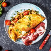 Ham & Cheese Omelette · Fluffy, buttery omelette with ham and melty cheese. Served with hash browns, toast and jelly...