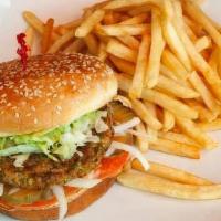 Veggie Burger · A delicious veggie patty, served on a bun topped with lettuce, tomato, pickle, onion, and 10...