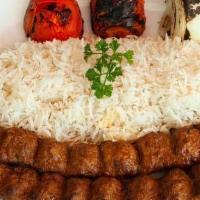 Beef Koobideh Kabob · Charboiled Ground Beef (2 Skewers) served with Persian Basmati Rice, Grilled Tomato, & Raw O...