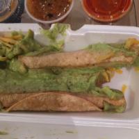 Rolled Taquitos · Rolled corn tortillas stuffed with
shredded beef of chicken topped with
Cheese & Guacamole