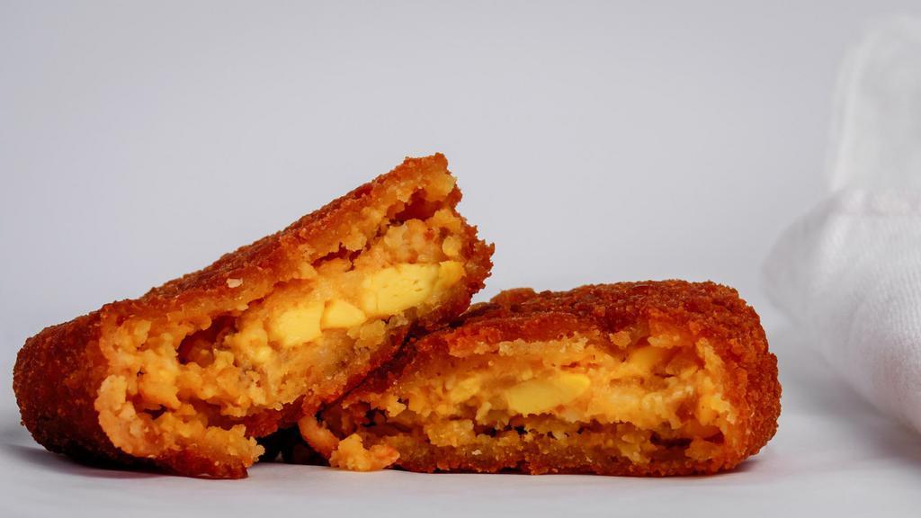 Early Risers Stuffed Hash Browns · Hash browns stuffed with bacon, egg and cheese.