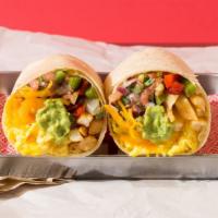 Vegetarian California Burrito · Breakfast burrito filled with eggs, cheese, fries, pico de gallo, and guacamole, and served ...