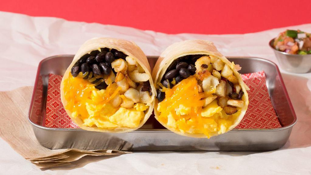 Vegetarian Breakfast Burrito · Breakfast burrito filled with eggs, sauteed onions and peppers, cheese, pico de gallo, rice, and beans, and served with a side of salsa.