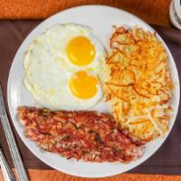 Corn Beef Hash & Eggs · Hash includes green bell peppers and chopped onions.