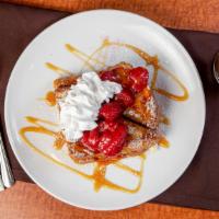 Stuffed French Toast · Stuffed with mascarpone cheese and topped with caramel sauce: choice of banana, strawberry o...