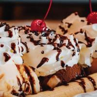 Banana Split · Three scoops of your choice of flavor of ice-cream in-between a banana, whipped-cream, choco...