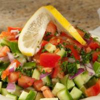 Shirazi Salad · Refreshing Mixture of Diced Tomatoes, Onions, Cucumbers, & Parsley Tossed Together With Lemo...
