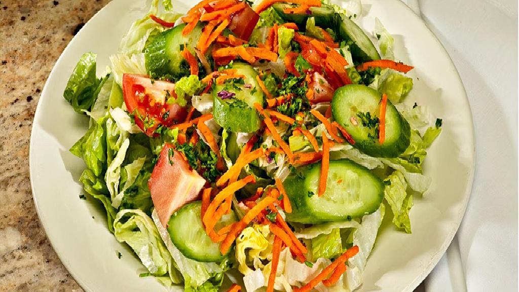 Green Garden Salad · Mixed Greens, Tomatoes, & Cucumbers Served with Special Vinegar Based House Dressing.