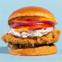 The Fried Chicken Sandwich · Buttermilk fried and served on a brioche bun with slaw, tomatoes, pickles, onions, and a chi...