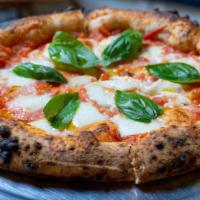 Margherita Pizza · Tomato sauce, buffalo mozzarella and fresh basil.