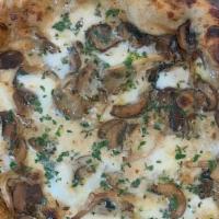 Mushroom Pizza · Crimini and oyster mushrooms, porcini cream, mozzarella, aged goat’s Gouda and truffle oil.