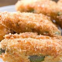 Jalapeño Poppers · Served with our secret popper jam sauce