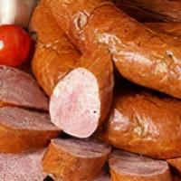Polish Sausage · Polska kielbasa, mild pork and beef sausage served on fresh baked village bakery rolls and c...