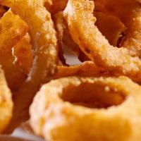 Onion Rings · Breaded home style onion rings golden fried serve with ketchup.